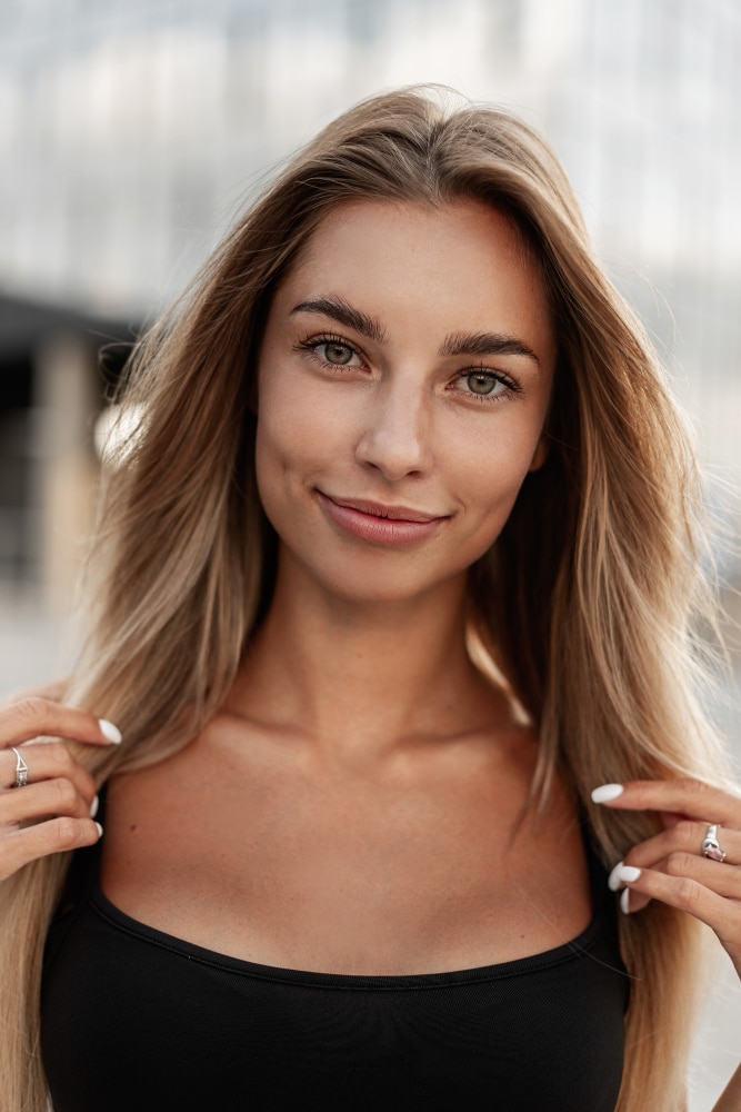 pretty woman holding hair